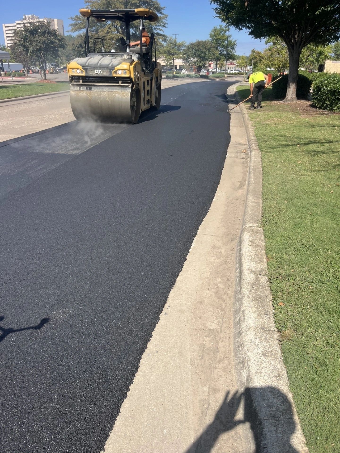 Roller compacting a fresh asphalt surface